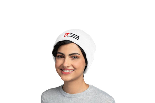 Person wearing a white beanie with a logo on a light gray background