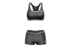 Black sports bra and shorts set with brand logo on a white background